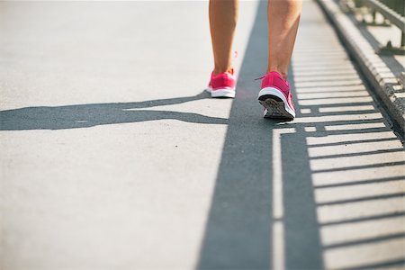 Closeup on fitness young woman walking in the city Stock Photo - Budget Royalty-Free & Subscription, Code: 400-07794013