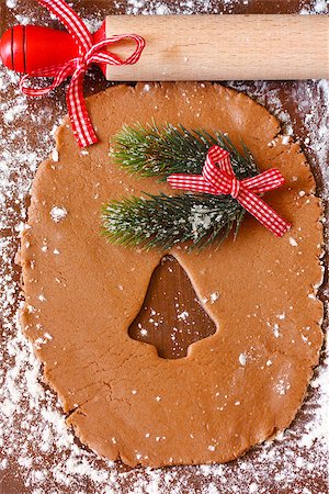 simsearch:400-05721521,k - Preparation for baking Christmas cookies. Gingerbread dough with bell cutter cookie and rolling pin. Stock Photo - Budget Royalty-Free & Subscription, Code: 400-07796186