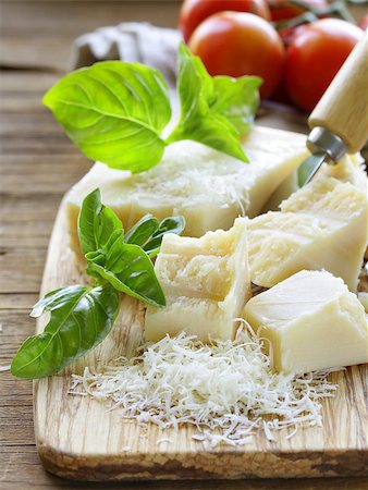 romano - fresh tasty hard parmesan cheese on a wooden board Stock Photo - Budget Royalty-Free & Subscription, Code: 400-07793944