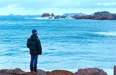simsearch:632-05759883,k - Boy to look on ocean. Tregastel coast morning spring view  (between Perros-Guirec and Pleumeur-Bodou, Brittany, France). The Pink Granite Coast. Stock Photo - Budget Royalty-Free & Subscription, Code: 400-07817282