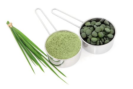 Wheat grass and powder with chlorella tablets over white background. Stock Photo - Budget Royalty-Free & Subscription, Code: 400-07818828