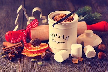 simsearch:400-05721521,k - Preparation for baking Christmas cookies. Brown sugar, spices, marshmallow, nuts, rolling pin and cookie cutters on wooden kitchen table. Toned photo. Stock Photo - Budget Royalty-Free & Subscription, Code: 400-07824822