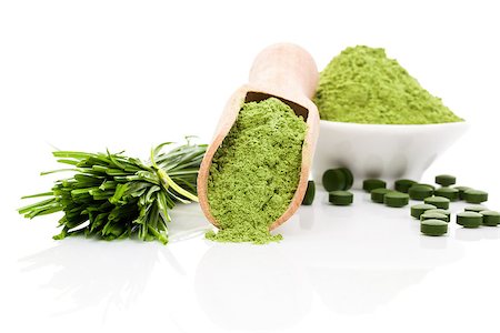 Spirulina; chlorella and wheatgrass. Green food supplement. Green pills; wheatgrass blades and ground powder isolated on white background. Healthy lifestyle. Stock Photo - Budget Royalty-Free & Subscription, Code: 400-07825805