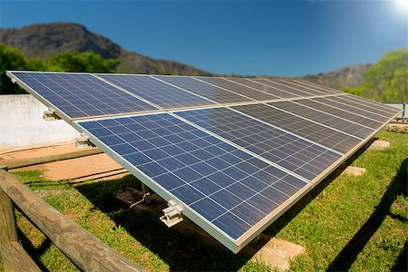 enviromentally friendly - A photo voltaic solar power installation in a rural area of South Africa, utilising the abundance of sunlight energy in summer. Stock Photo - Budget Royalty-Free & Subscription, Code: 400-07826085