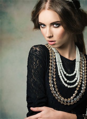 simsearch:400-05287348,k - gorgeous woman wearing like a antique dame in charming pose with vintage hair-style and very precious jewellery Stock Photo - Budget Royalty-Free & Subscription, Code: 400-07820045