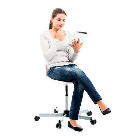 simsearch:400-05734244,k - Beautiful female student sitting on a chair with a tablet, isolated over a white background Stock Photo - Budget Royalty-Free & Subscription, Code: 400-07820195