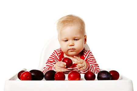 simsearch:400-04875091,k - Sweet baby is sitting on chair and selecting plums. Stock Photo - Budget Royalty-Free & Subscription, Code: 400-07821101