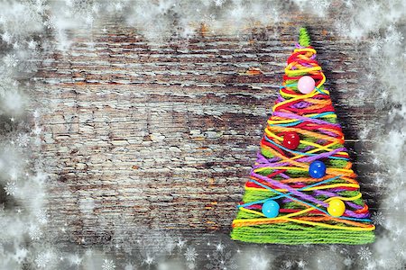 Handmade knitted Christmas tree on old wooden background Stock Photo - Budget Royalty-Free & Subscription, Code: 400-07821985