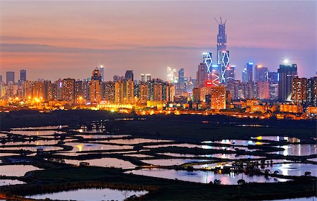 hong kong countryside at night; rice field and modern office buildings Stock Photo - Budget Royalty-Free & Subscription, Code: 400-07822317