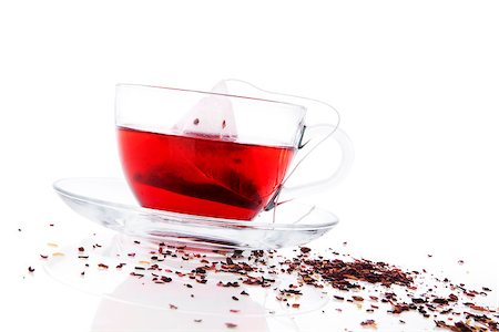 simsearch:400-04273561,k - Red fruit tea in transparent tea cup with tea bag. Dried tea in background. Healthy winter drink concept. Stock Photo - Budget Royalty-Free & Subscription, Code: 400-07822634