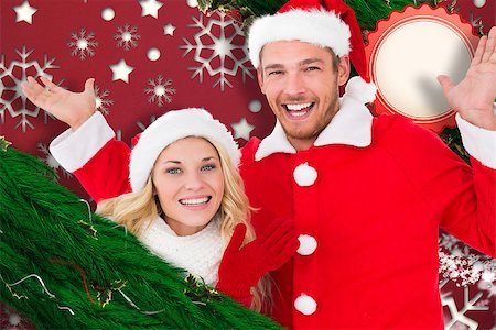 Young festive couple against snowflake wallpaper pattern Stock Photo - Budget Royalty-Free & Subscription, Code: 400-07834604
