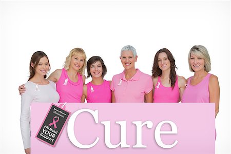 simsearch:400-07835111,k - Smiling women wearing pink for breast cancer awareness against pink card Stock Photo - Budget Royalty-Free & Subscription, Code: 400-07834839