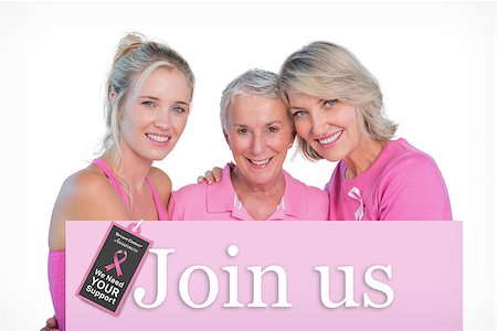 simsearch:400-07835111,k - Embracing women wearing pink tops and ribbons for breast cancer against pink card Stock Photo - Budget Royalty-Free & Subscription, Code: 400-07834846