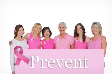 simsearch:400-07835111,k - Smiling women wearing pink for breast cancer awareness against pink card Stock Photo - Budget Royalty-Free & Subscription, Code: 400-07834840