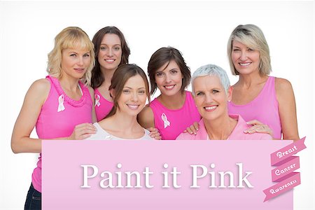 simsearch:400-07835111,k - Happy women posing and wearing pink for breast cancer against pink card Stock Photo - Budget Royalty-Free & Subscription, Code: 400-07834854