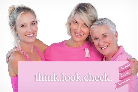 simsearch:400-07835111,k - Women wearing pink tops and ribbons for breast cancer against pink card Stock Photo - Budget Royalty-Free & Subscription, Code: 400-07834857