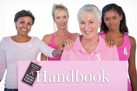 simsearch:400-07835111,k - Supportive group of women wearing pink tops and breast cancer ribbons against pink card Stock Photo - Budget Royalty-Free & Subscription, Code: 400-07834859