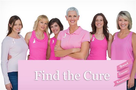 simsearch:400-07835111,k - Enthusiastic women posing with pink tops for breast cancer against pink card Stock Photo - Budget Royalty-Free & Subscription, Code: 400-07834852