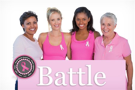 simsearch:400-07835111,k - Smiling women wearing pink tops and breast cancer ribbons against pink card Stock Photo - Budget Royalty-Free & Subscription, Code: 400-07834866