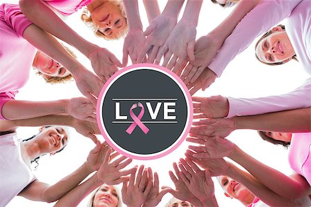 simsearch:400-07834847,k - Happy women in circle wearing pink for breast cancer against breast cancer awareness message on poster Stock Photo - Budget Royalty-Free & Subscription, Code: 400-07835035