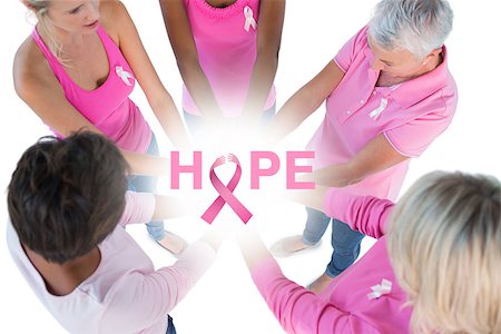 simsearch:400-07835111,k - Group wearing pink and ribbons for breast cancer with hands together against breast cancer awareness message Stock Photo - Budget Royalty-Free & Subscription, Code: 400-07835036