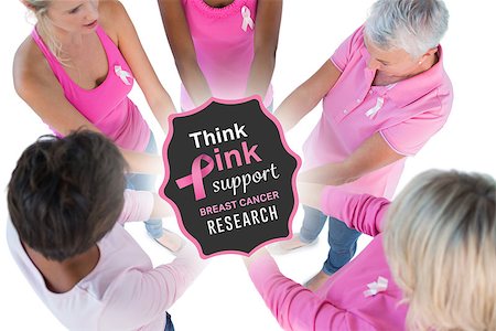 simsearch:400-07835111,k - Group wearing pink and ribbons for breast cancer with hands together against breast cancer awareness message Stock Photo - Budget Royalty-Free & Subscription, Code: 400-07835037