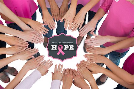 simsearch:400-07834847,k - Hands joined in circle wearing pink for breast cancer against breast cancer awareness message Stock Photo - Budget Royalty-Free & Subscription, Code: 400-07835039