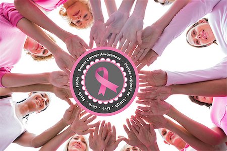simsearch:400-07834847,k - Happy women in circle wearing pink for breast cancer against breast cancer awareness message in pink Stock Photo - Budget Royalty-Free & Subscription, Code: 400-07835046