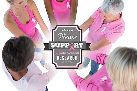 simsearch:400-07835111,k - Group wearing pink and ribbons for breast cancer with hands together against breast cancer awareness message Stock Photo - Budget Royalty-Free & Subscription, Code: 400-07835043