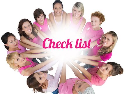simsearch:400-07834847,k - Cheerful women joined in a circle and looking up at camera wearing pink for breast cancer on white background Stock Photo - Budget Royalty-Free & Subscription, Code: 400-07835065