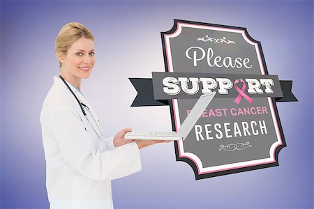 simsearch:400-07834847,k - Doctor with breast cancer awareness message for awareness month Stock Photo - Budget Royalty-Free & Subscription, Code: 400-07835068