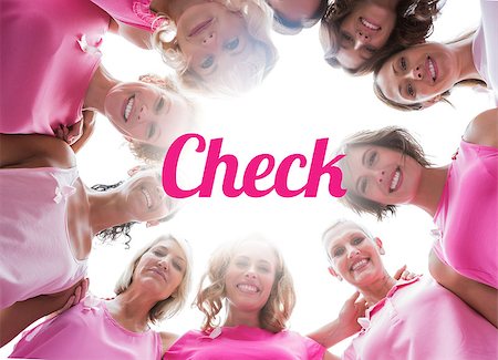 simsearch:400-07834847,k - Happy women smiling in circle wearing pink for breast cancer on white background Stock Photo - Budget Royalty-Free & Subscription, Code: 400-07835071
