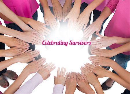 simsearch:400-07834847,k - Hands joined in circle wearing pink for breast cancer on white background Stock Photo - Budget Royalty-Free & Subscription, Code: 400-07835094