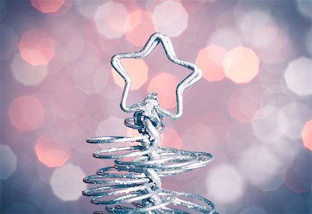 detail of metallic modern christmas star on bokeh background with space for text Stock Photo - Budget Royalty-Free & Subscription, Code: 400-07830417