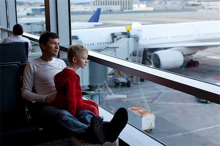 family of two waiting at the airport Stock Photo - Budget Royalty-Free & Subscription, Code: 400-07831492