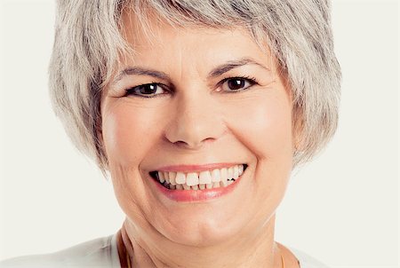 simsearch:400-07221782,k - Portrait of a senior woman smiling, isolated on white Stock Photo - Budget Royalty-Free & Subscription, Code: 400-07894213