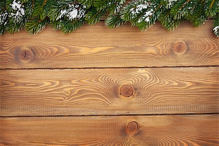 Christmas fir tree with snow on rustic wooden board with copy space Stock Photo - Budget Royalty-Free & Subscription, Code: 400-07894956