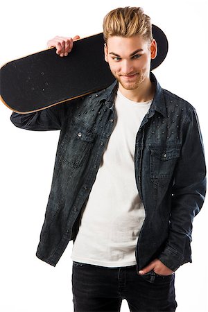 simsearch:400-04332775,k - Studio portrait of a young man posing with a skateboard Stock Photo - Budget Royalty-Free & Subscription, Code: 400-07896671