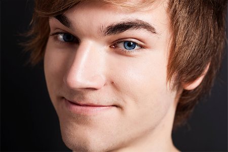 simsearch:400-04332775,k - Close-up portrait of a happy young man looking into the camera Stock Photo - Budget Royalty-Free & Subscription, Code: 400-07897639