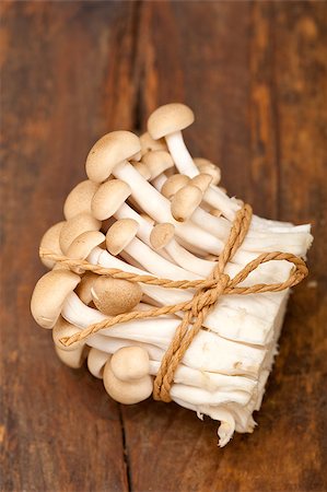 simsearch:400-04824992,k - bunch of fresh wild mushrooms on a rustic wood table tied with a rope Stock Photo - Budget Royalty-Free & Subscription, Code: 400-07898042