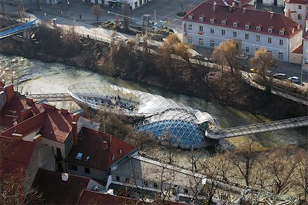 Graz, Austria - January 16, 2011: Island on Mur river connected by a modern steel and glass bridge, Styria, Graz, Austria Stock Photo - Budget Royalty-Free & Subscription, Code: 400-07899433