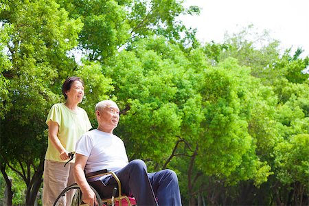 senior laughing with caregiver - Asian senior man sitting on a wheelchair with his wife Stock Photo - Budget Royalty-Free & Subscription, Code: 400-07891817