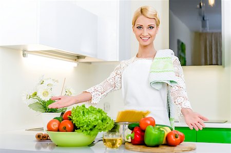 simsearch:400-05744780,k - Young woman in the kitchen.Healthy Food. Dieting Concept. Healthy Lifestyle. Cooking At Home. Stock Photo - Budget Royalty-Free & Subscription, Code: 400-07891955