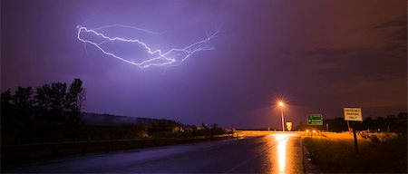 simsearch:400-04256241,k - Lightning erupts over a lonley highway onramp in Nisquallly Valley Stock Photo - Budget Royalty-Free & Subscription, Code: 400-07892240