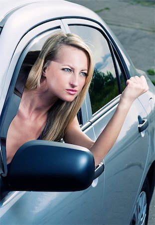 simsearch:400-06363059,k - Angry blond young woman sitting in a car Stock Photo - Budget Royalty-Free & Subscription, Code: 400-07892329