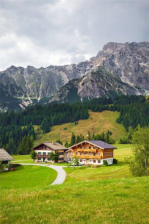 Dienten am Hochkönig, Austria - August 8, 2013: Beautiful typical mountain guests houses on austrian alps, Austria Stock Photo - Budget Royalty-Free & Subscription, Code: 400-07893655