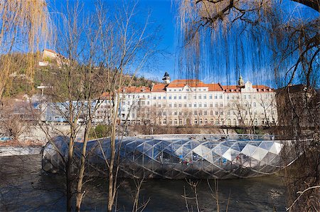 Graz, Austria - January 16, 2011: Island on Mur river connected by a modern steel and glass bridge, Styria, Graz, Austria Stock Photo - Budget Royalty-Free & Subscription, Code: 400-07900193