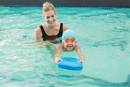 swimming class - Cute little boy learning to swim with coach at the leisure center Stock Photo - Budget Royalty-Free & Subscription, Code: 400-07900989