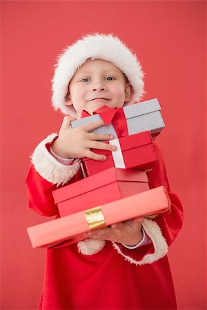 simsearch:640-03260410,k - Cute little boy in santa costume on red background Stock Photo - Budget Royalty-Free & Subscription, Code: 400-07902236