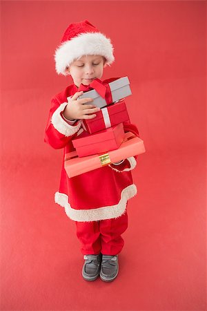 simsearch:640-03260410,k - Cute little boy in santa costume on red background Stock Photo - Budget Royalty-Free & Subscription, Code: 400-07902237